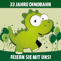 Grüner Dinosaurier mit weißem Auge und breitem Lächeln, Text '32 Jahre Dinobahn' und 'Feiern Sie mit uns!' auf grünem Hintergrund